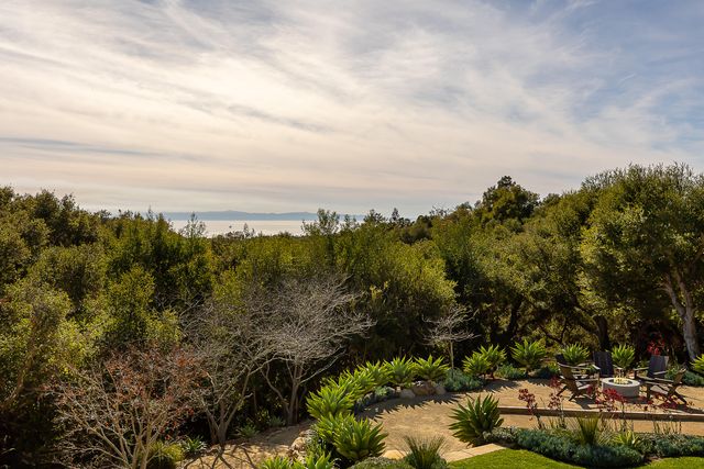 a view of a lake with green field