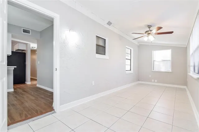 a view of an empty room with a window