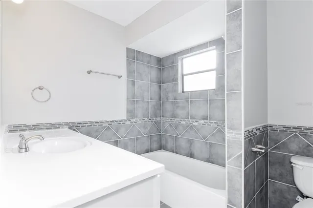 a bathroom with a sink and a bathtub