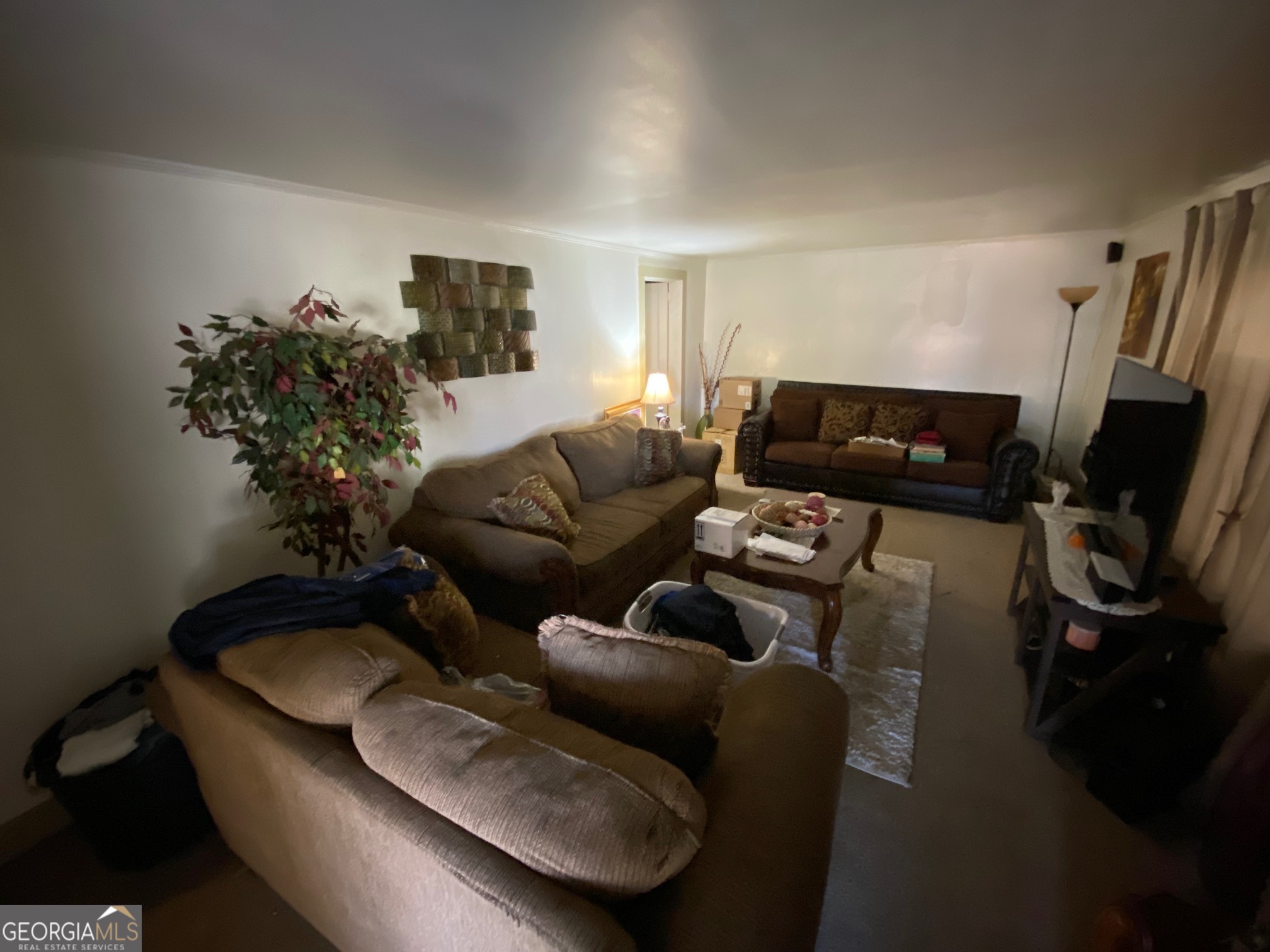 912 Thomas Street Macon, GA 31206 - Photo 10 of 23 a living room with furniture and a flat screen tv