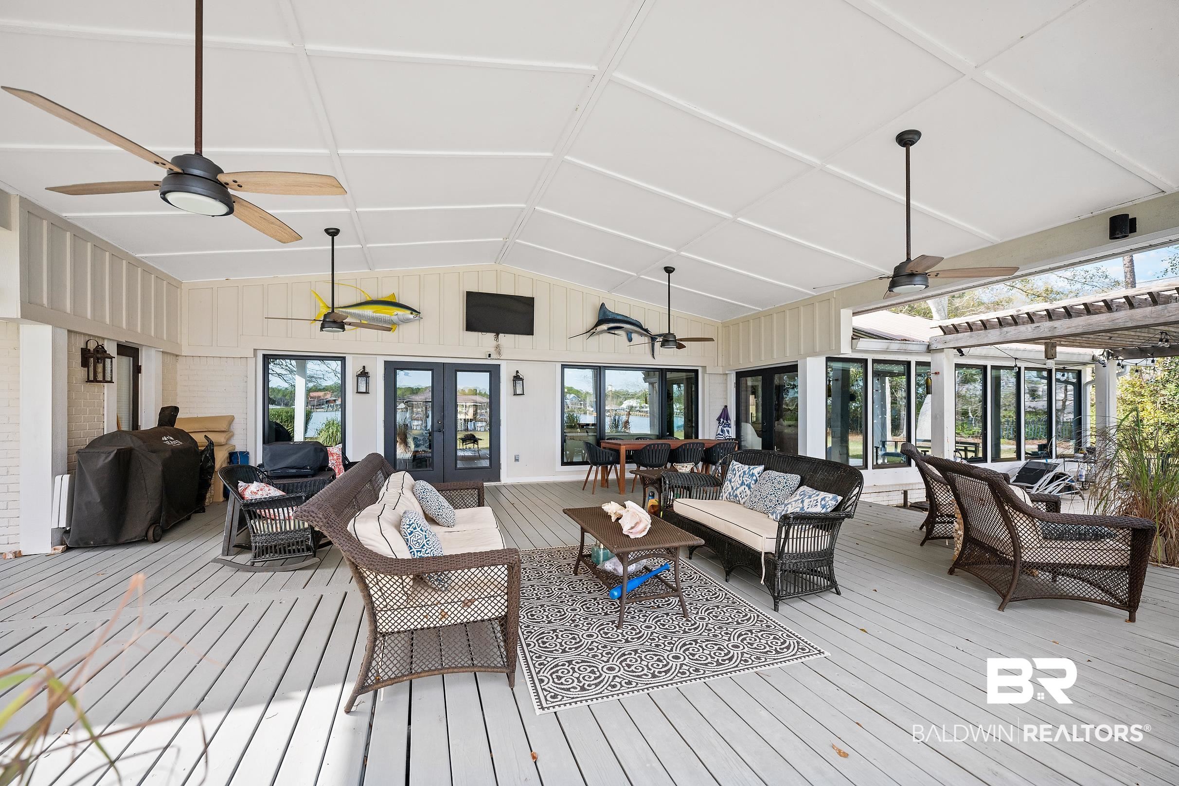 8490 Bay View Drive Foley, AL 36535 - Photo 15 of 67 Deck featuring an outdoor hangout area, ceiling fan, and area for grilling