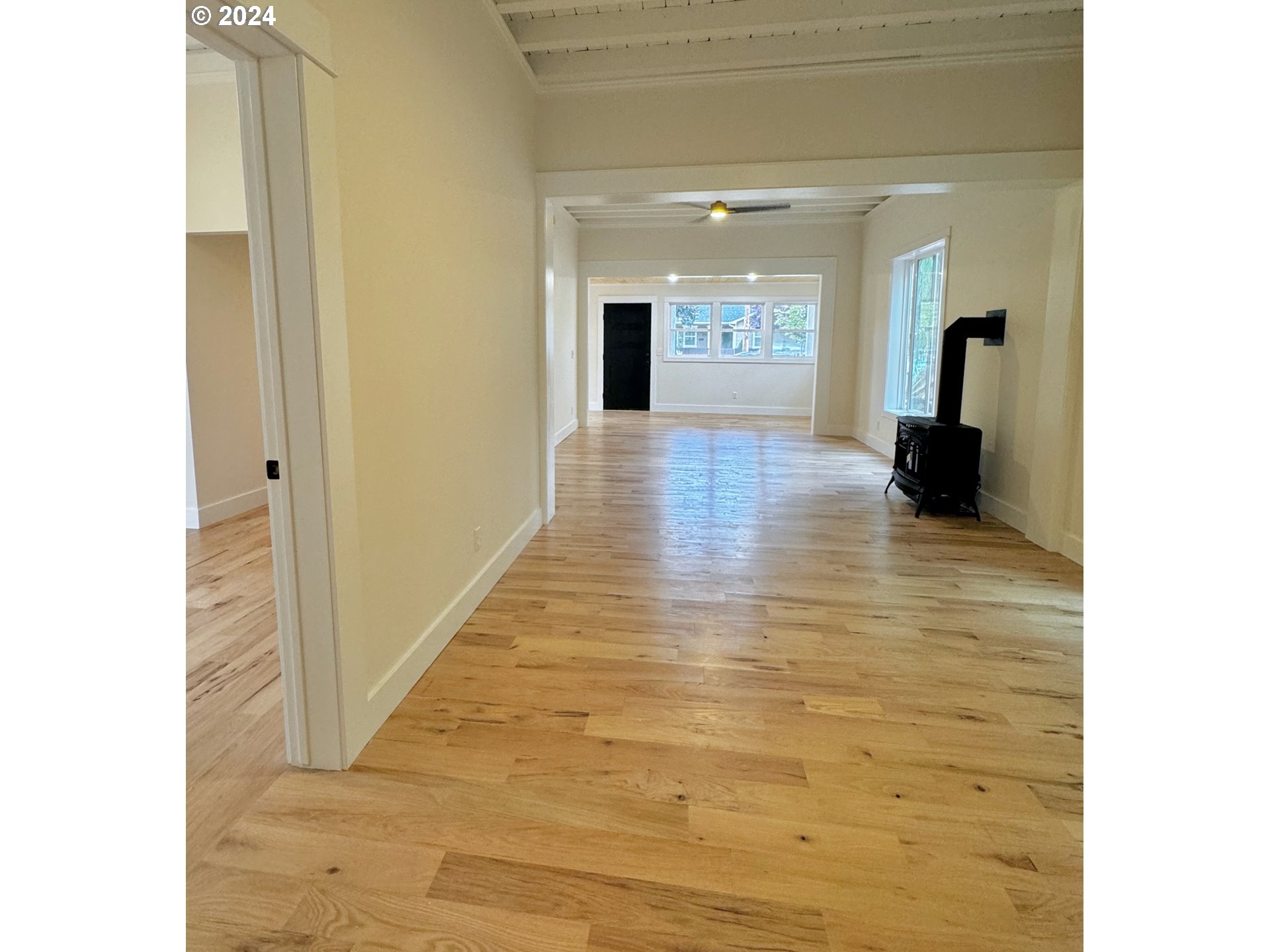 2231 3rd Street Baker City, OR 97814 - Photo 11 of 48 a view of a hallway with wooden floor