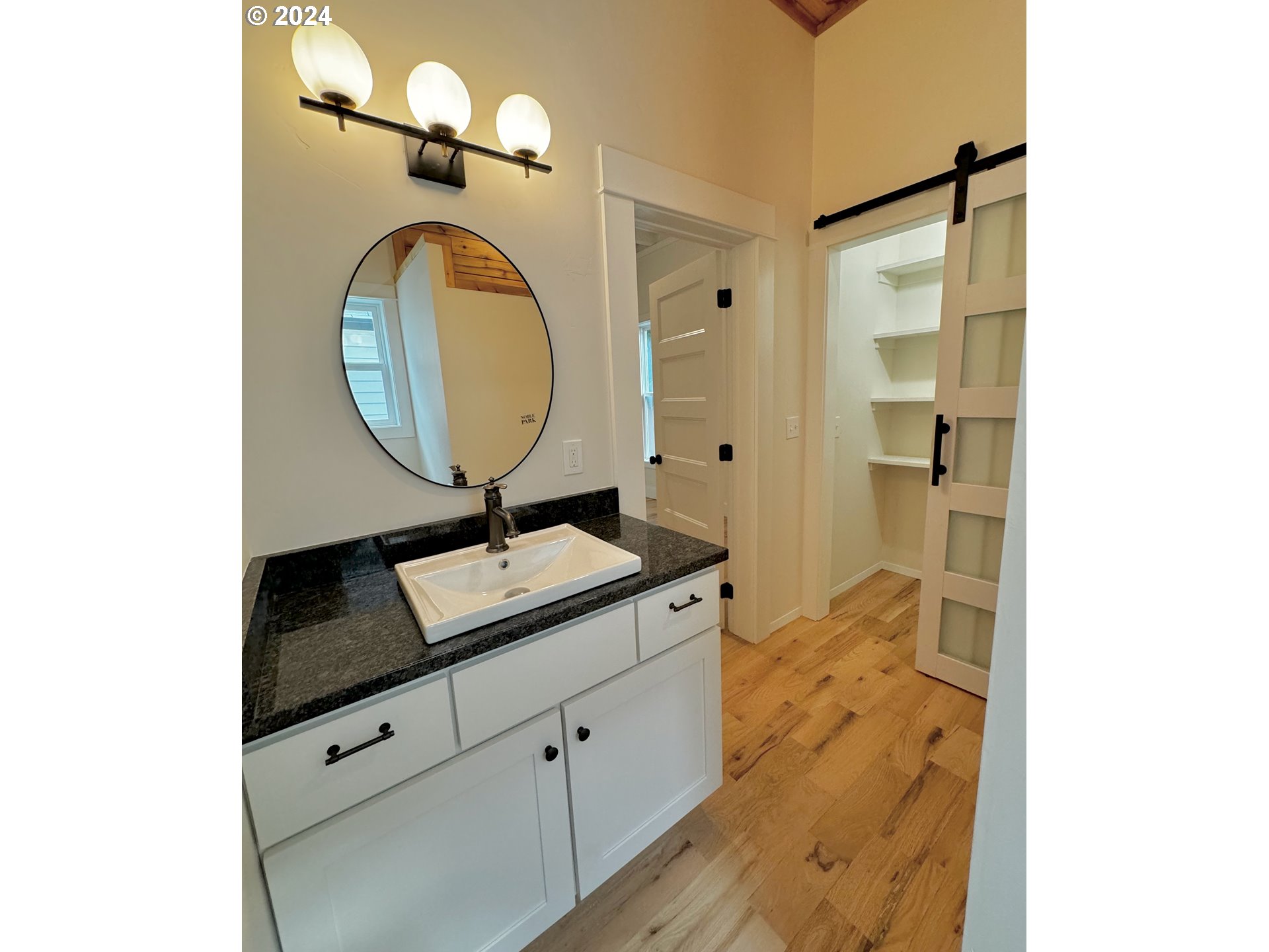 2231 3rd Street Baker City, OR 97814 - Photo 15 of 48 a bathroom with a sink and a mirror