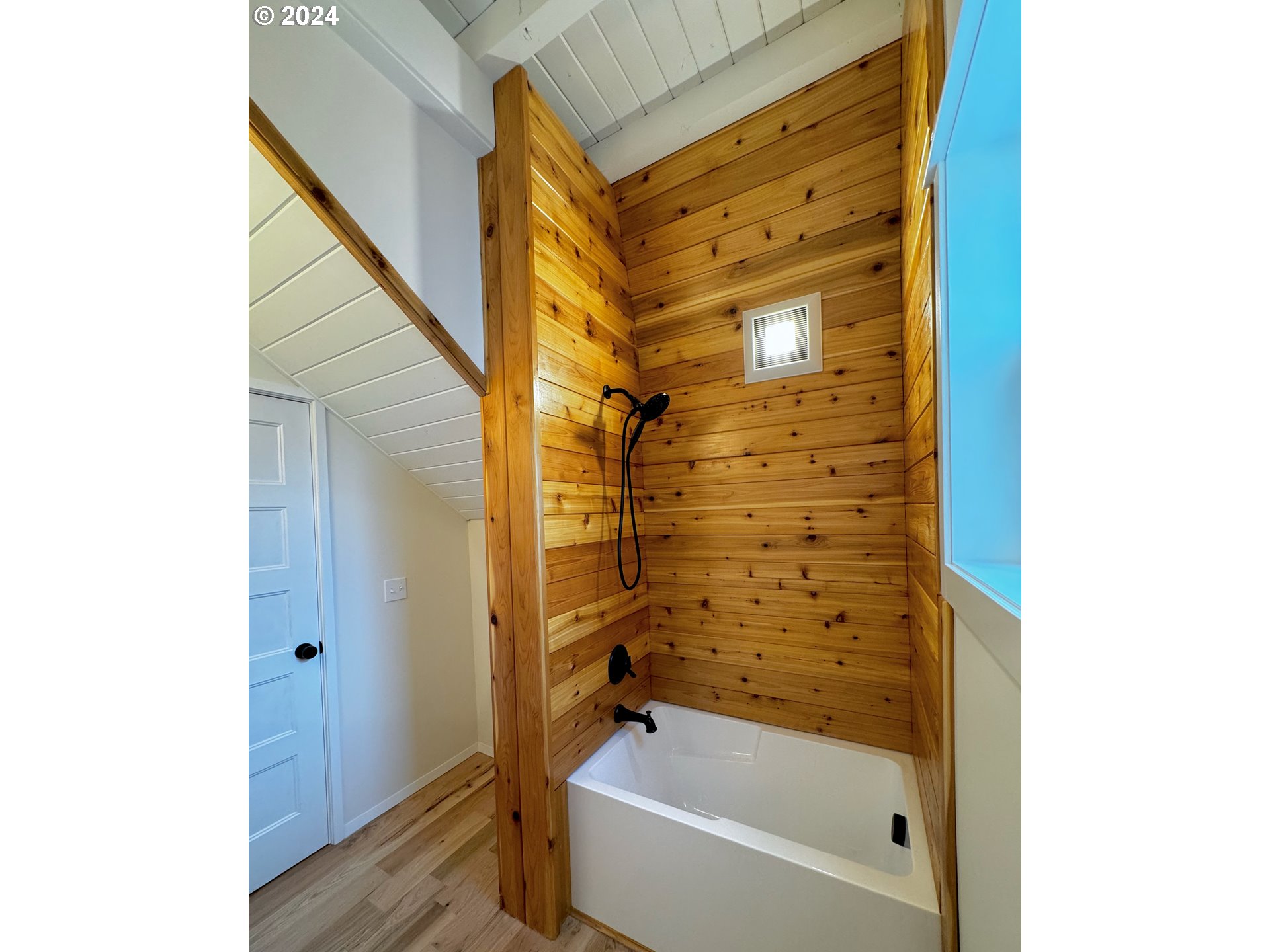 2231 3rd Street Baker City, OR 97814 - Photo 24 of 48 a bathroom with a bathtub and shower
