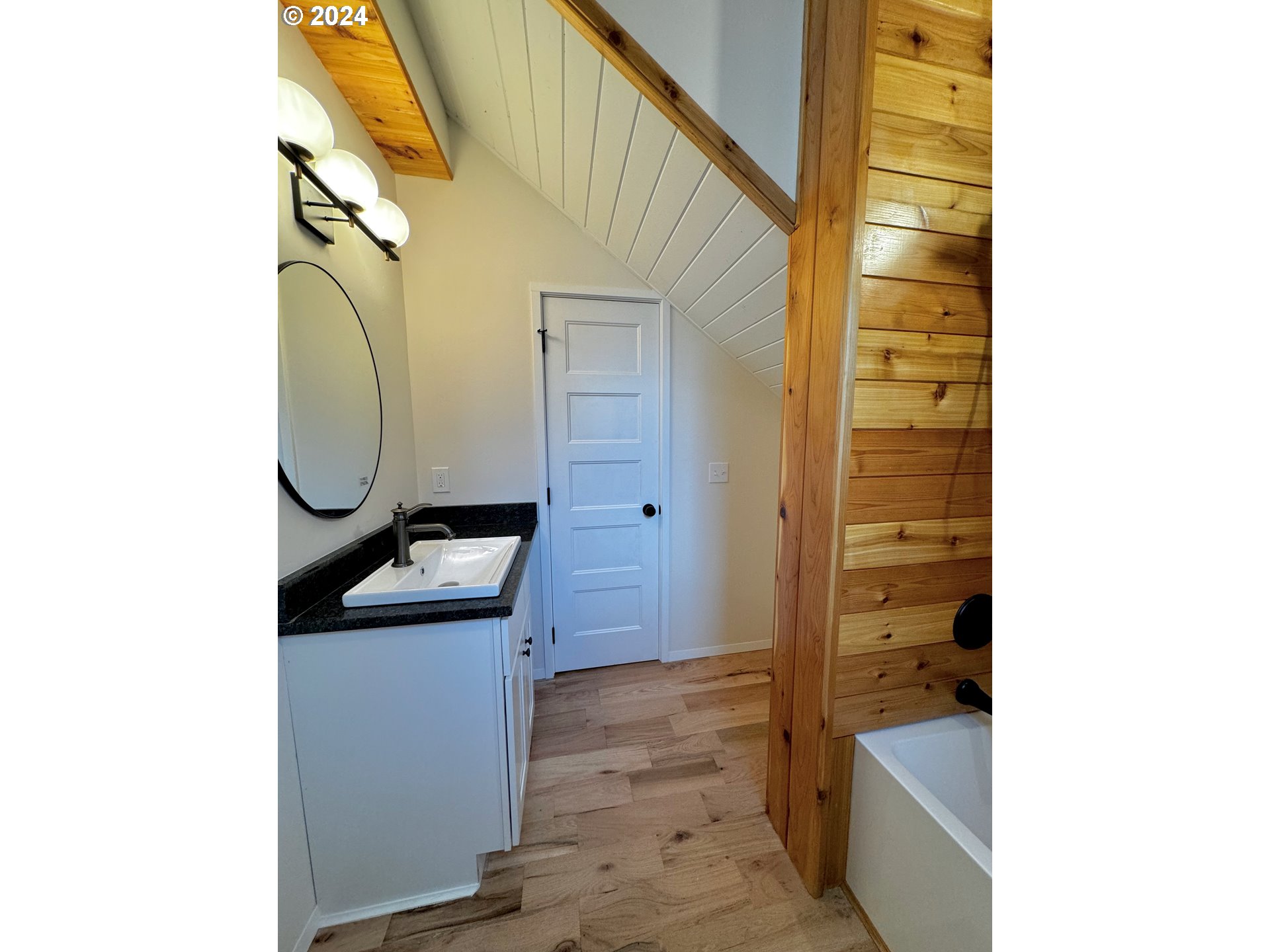 2231 3rd Street Baker City, OR 97814 - Photo 25 of 48 a bathroom with a sink and mirror