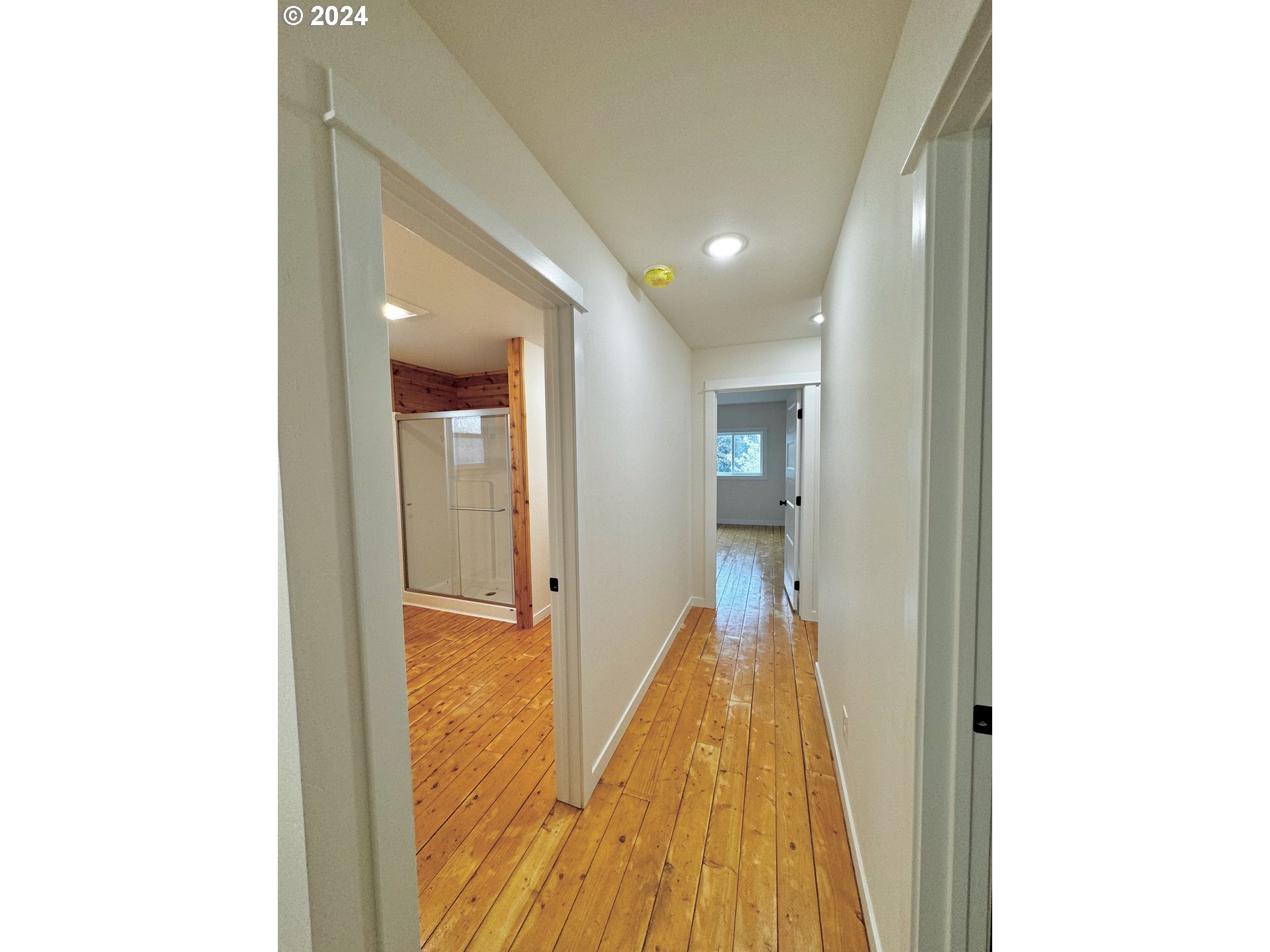 2231 3rd Street Baker City, OR 97814 - Photo 34 of 48 a view of a hallway with wooden floor