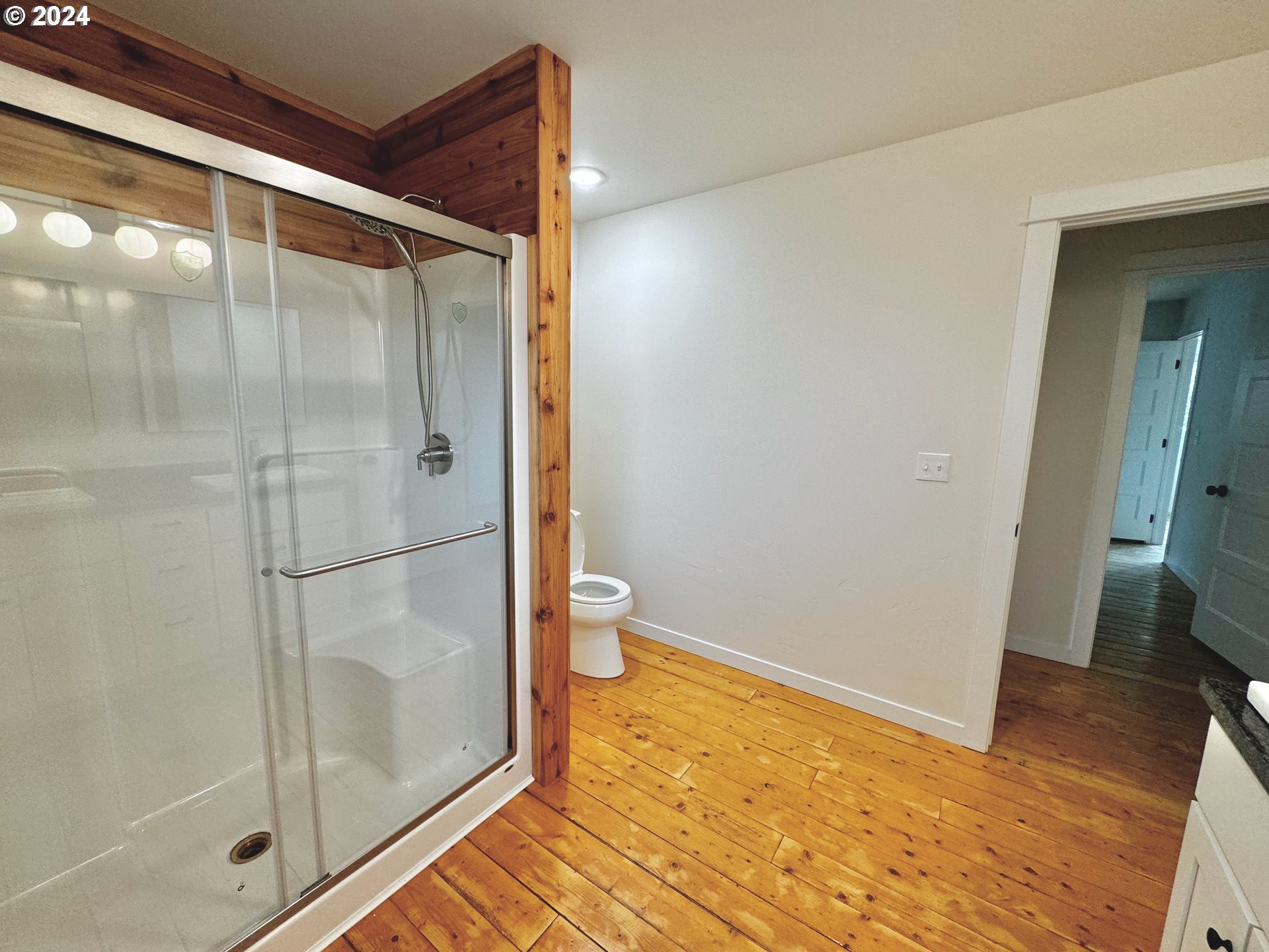 2231 3rd Street Baker City, OR 97814 - Photo 36 of 48 a bathroom with a glass shower door