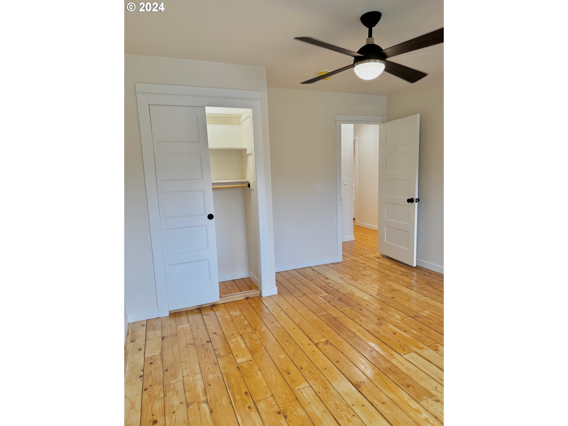 2231 3rd Street Baker City, OR 97814 - Photo 38 of 48 a bedroom with a bed and a chandelier