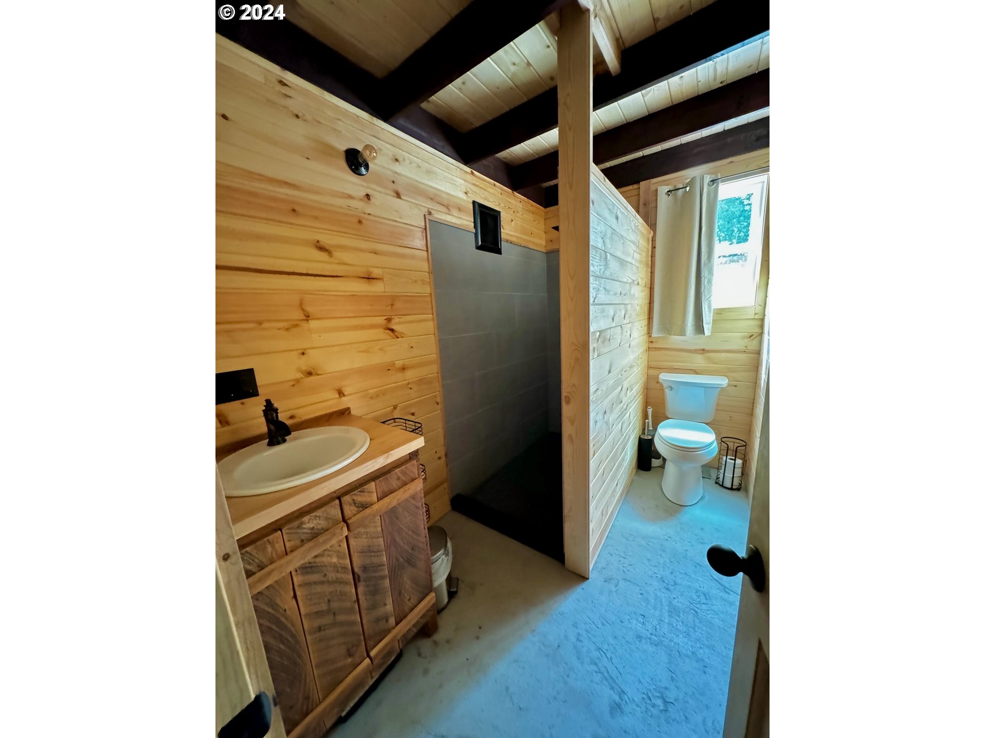 2231 3rd Street Baker City, OR 97814 - Photo 42 of 48 a bathroom with a sink and a shower