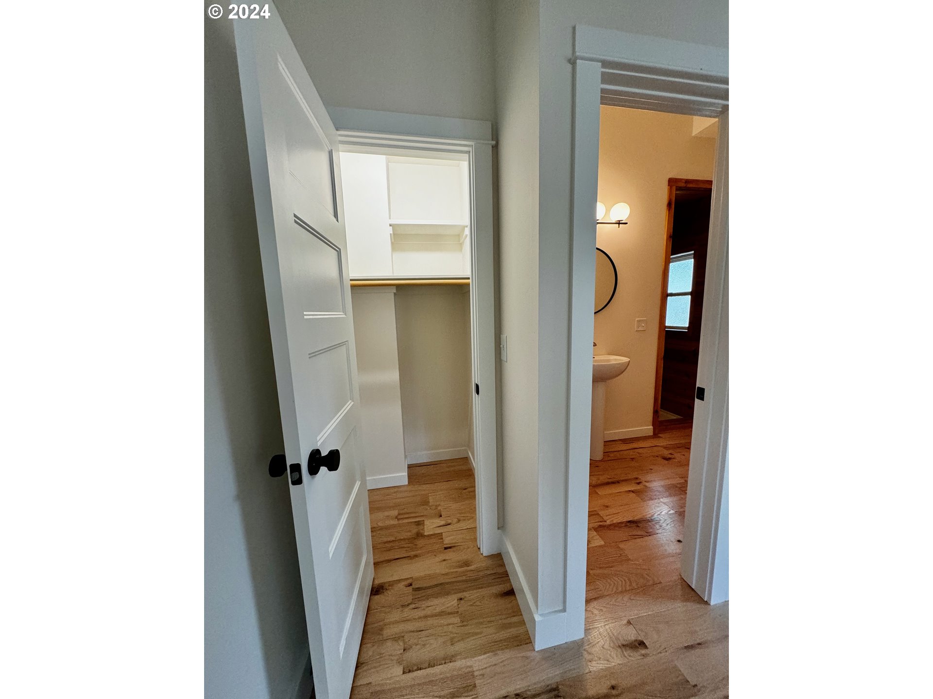 2231 3rd Street Baker City, OR 97814 - Photo 7 of 48 a view of a hallway with wooden floor and a bathroom