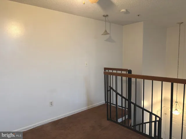 a view of hallway with stairs