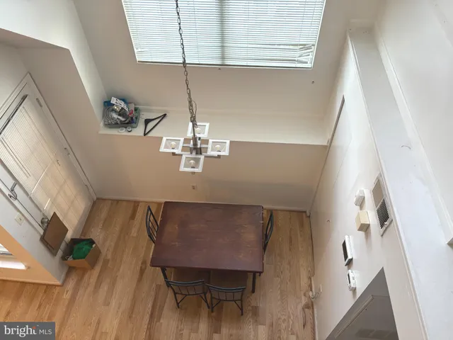a view of a livingroom with furniture wooden floor and staircase