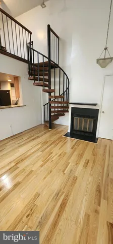 a view of staircase with white walls and a window