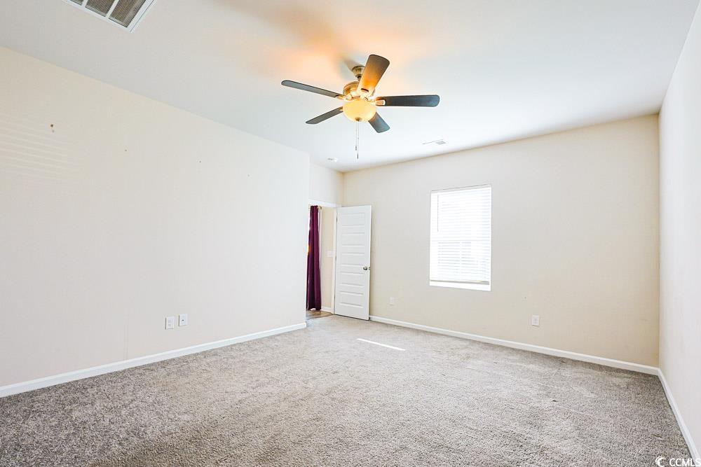 1560 Swing Bridge Way Myrtle Beach, SC 29588 - Photo 10 of 35 Unfurnished room with light carpet and a ceiling fan