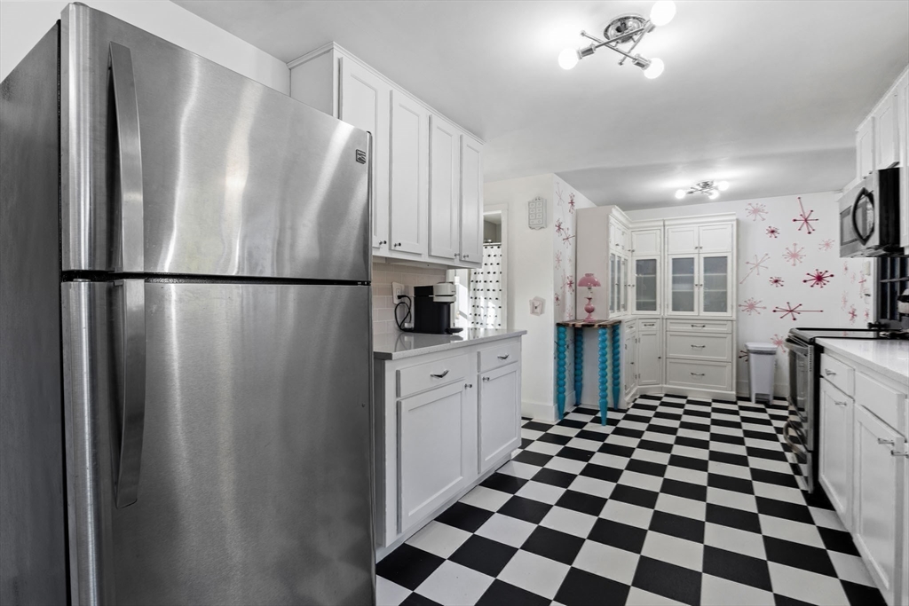 18 Carlton Road Bourne, MA 02532 - Photo 12 of 41 a kitchen with stainless steel appliances a refrigerator and cabinets