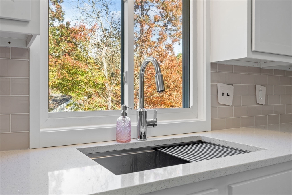 18 Carlton Road Bourne, MA 02532 - Photo 14 of 41 a view of a sink a bath tub and a window