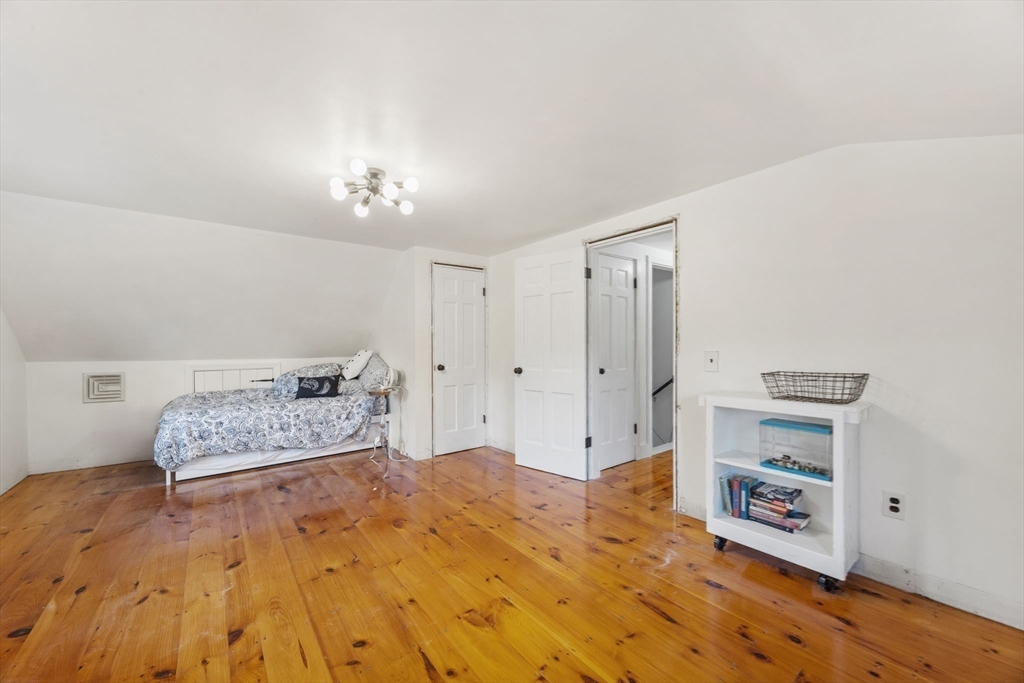18 Carlton Road Bourne, MA 02532 - Photo 25 of 41 a bedroom with a bed and a cabinets