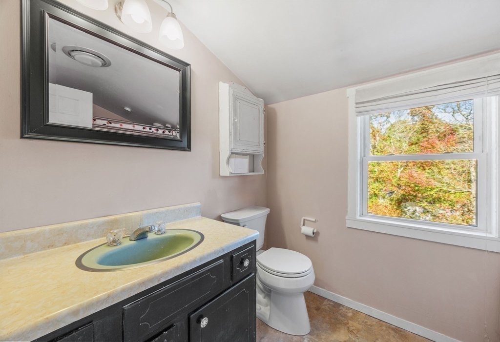 18 Carlton Road Bourne, MA 02532 - Photo 26 of 41 a bathroom with a toilet a sink and a mirror