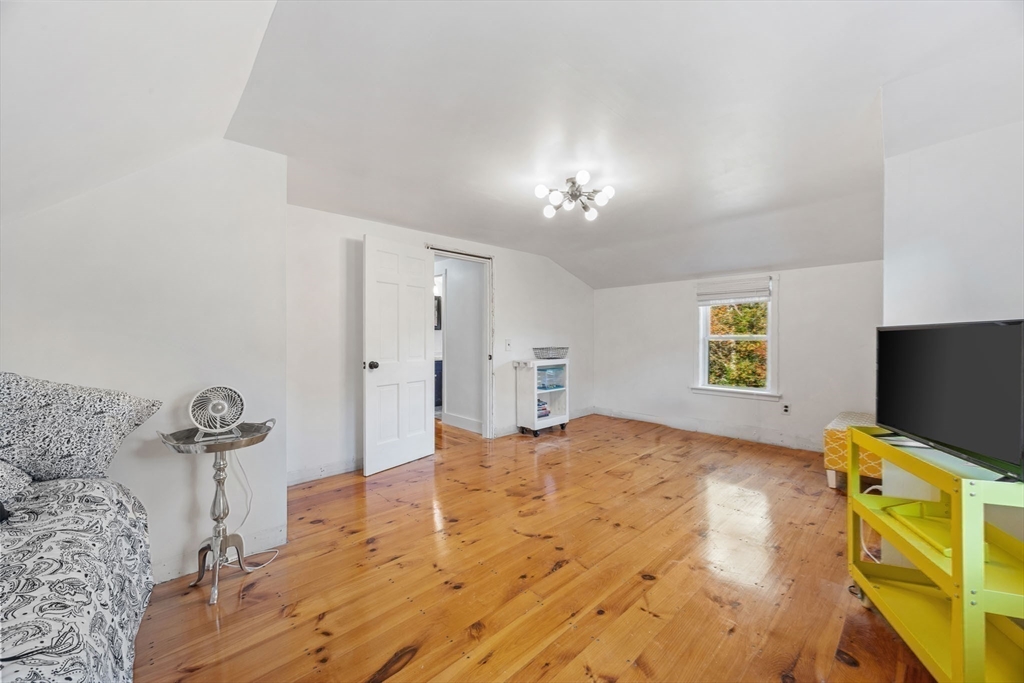 18 Carlton Road Bourne, MA 02532 - Photo 27 of 41 a bedroom with a bed and a flat screen tv