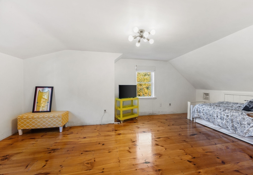 18 Carlton Road Bourne, MA 02532 - Photo 28 of 41 a bedroom with a bed and a table in it