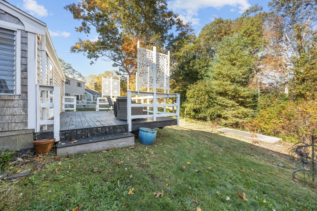 18 Carlton Road Bourne, MA 02532 - Photo 30 of 41 a view of a back yard of the house
