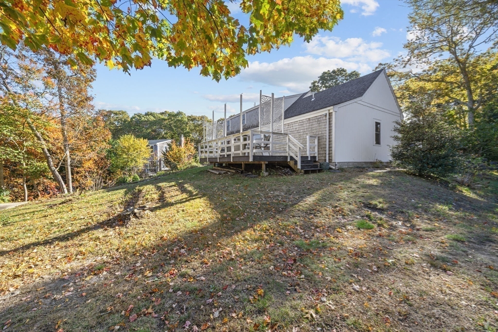 18 Carlton Road Bourne, MA 02532 - Photo 31 of 41 a view of a house with a yard