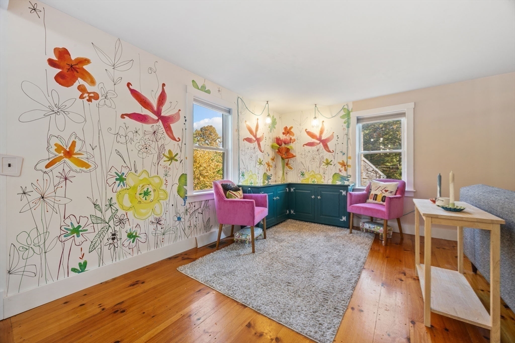 18 Carlton Road Bourne, MA 02532 - Photo 8 of 41 a living room with patio furniture and a wooden floor