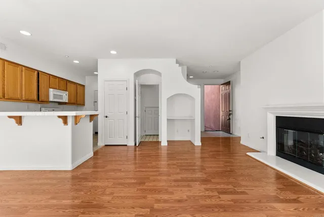 a view of a kitchen with microwave and cabinets