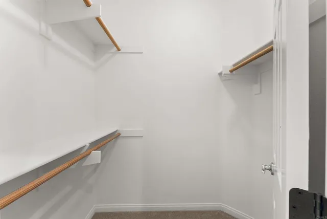 a bedroom with furniture and a book shelf