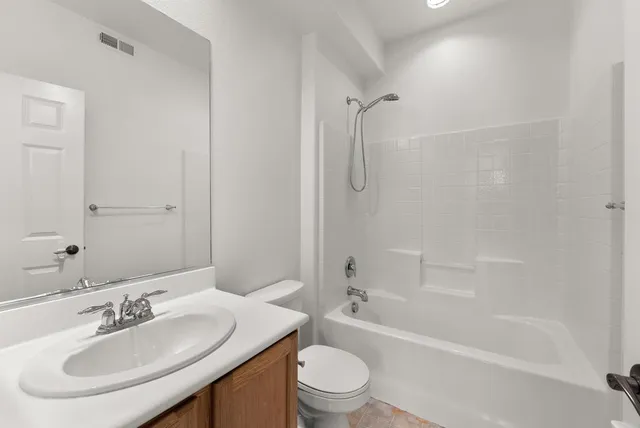 a view of a patio with couches chairs and potted plants