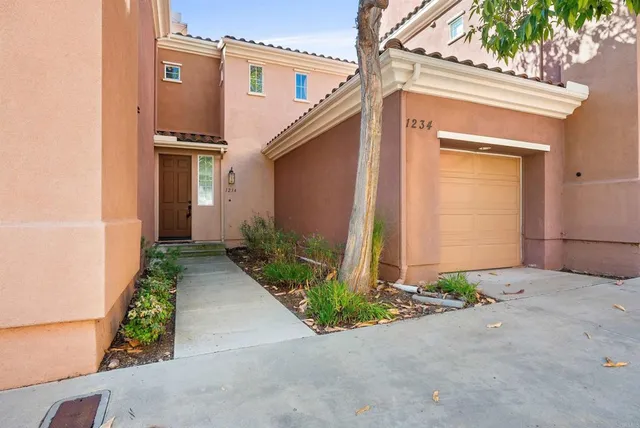 a front view of a house with garage