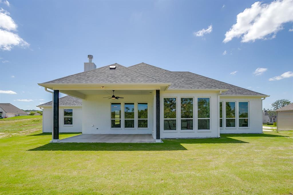 9012 Valley Oak Court Springtown, TX 76082 - Photo 37 of 40 a view of an house with swimming pool and porch