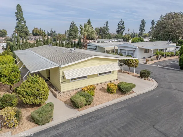 an aerial view of a house with yard swimming pool and outdoor seating