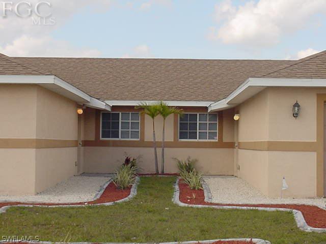 717 Alabama Road South Lehigh Acres, FL 33974 - Photo 2 of 9 a house view with a outdoor space