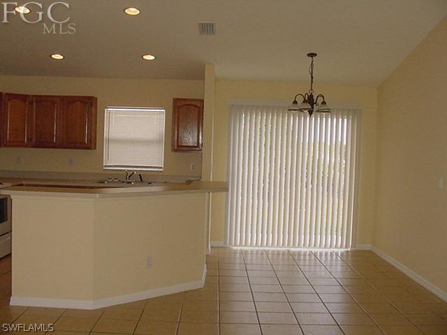 717 Alabama Road South Lehigh Acres, FL 33974 - Photo 4 of 9 a view of a livingroom with furniture