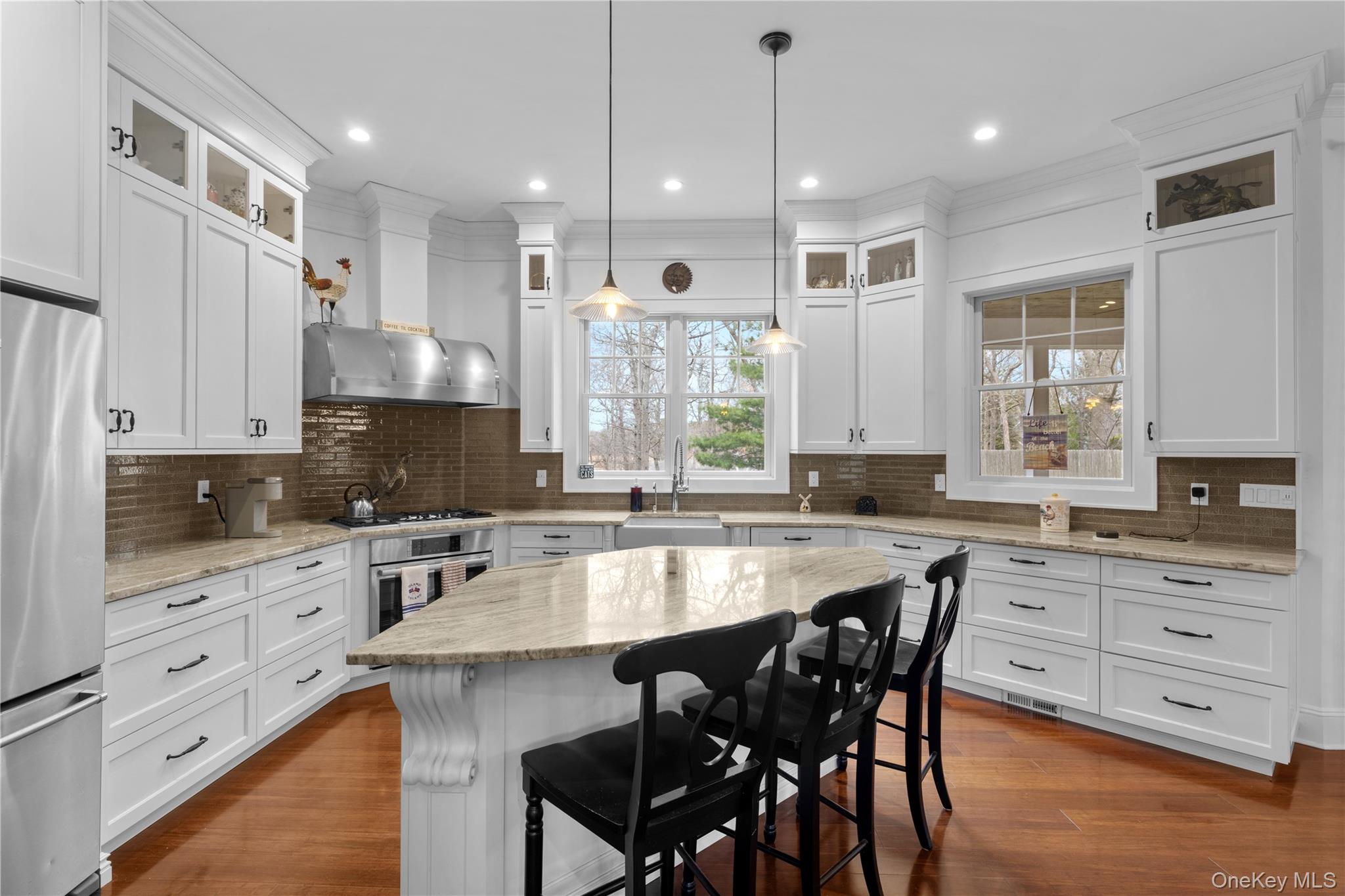 360 Masters Road Laurel, NY 11948 - Photo 16 of 49 a large kitchen with cabinets table and chairs