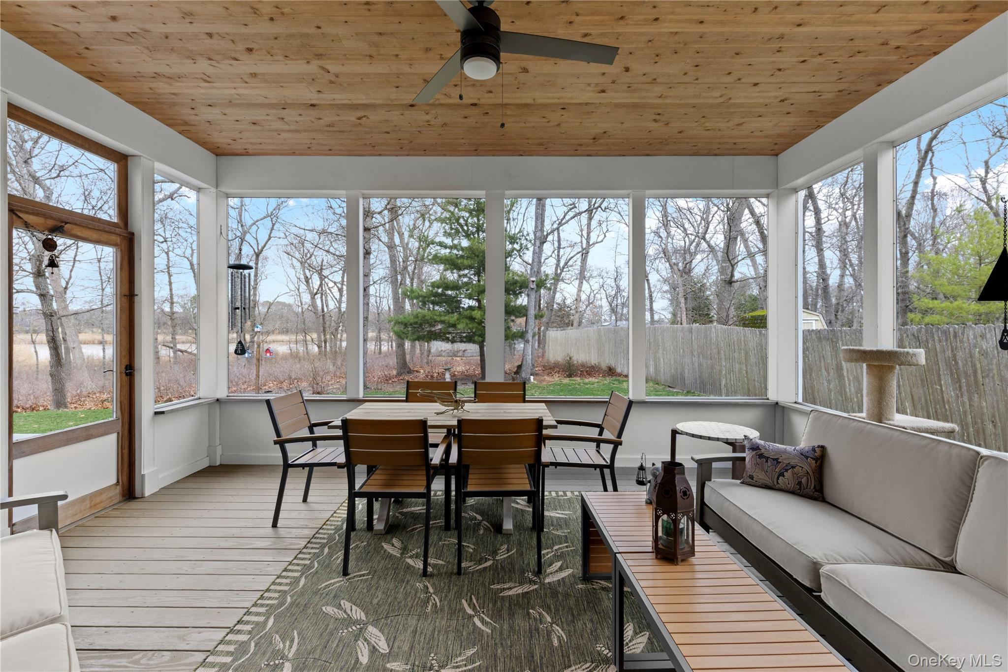 360 Masters Road Laurel, NY 11948 - Photo 19 of 49 a dining room with furniture and wooden floor