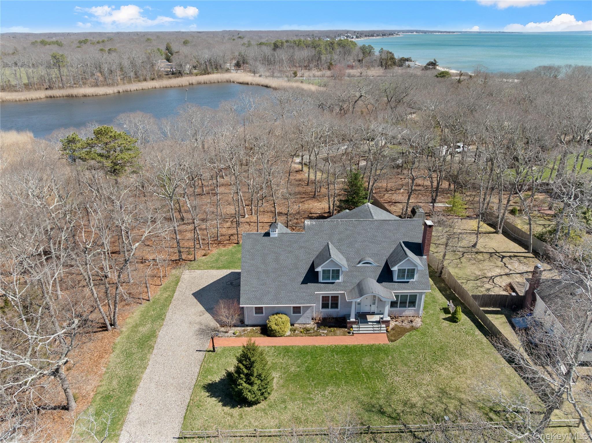 360 Masters Road Laurel, NY 11948 - Photo 2 of 49 an aerial view of a house with outdoor space