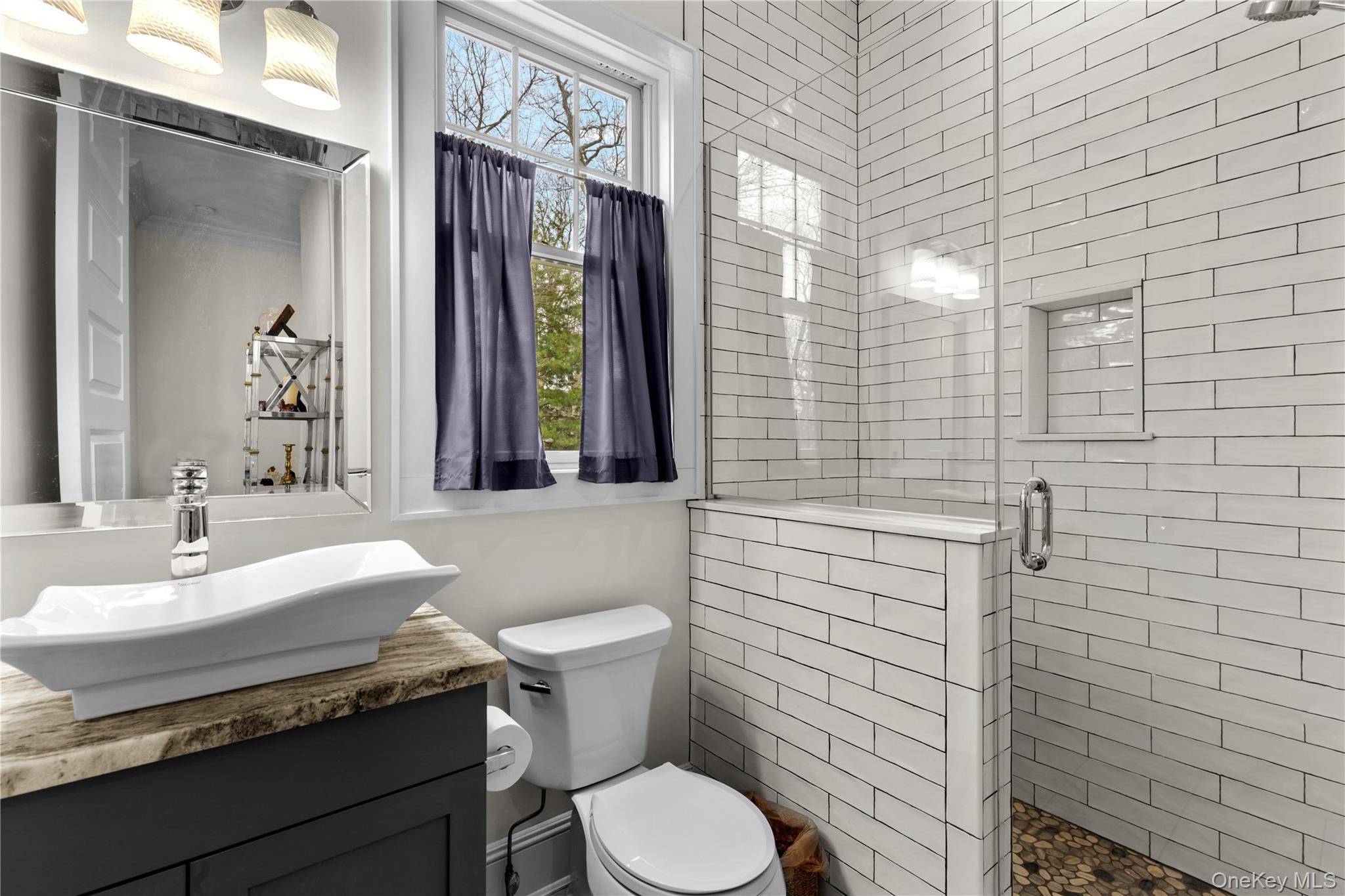 360 Masters Road Laurel, NY 11948 - Photo 23 of 49 a bathroom with a sink a toilet and mirror