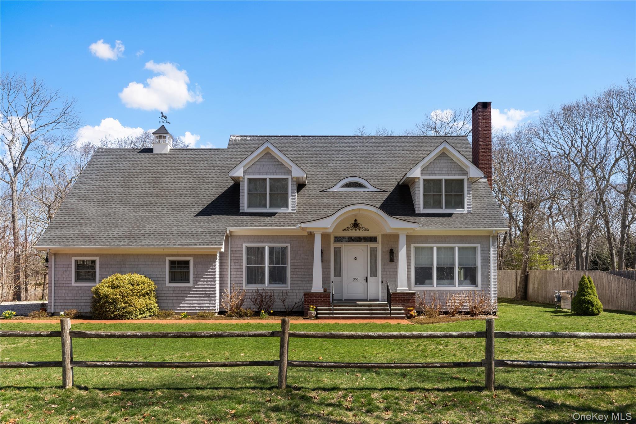 360 Masters Road Laurel, NY 11948 - Photo 3 of 49 a front view of a house with a yard