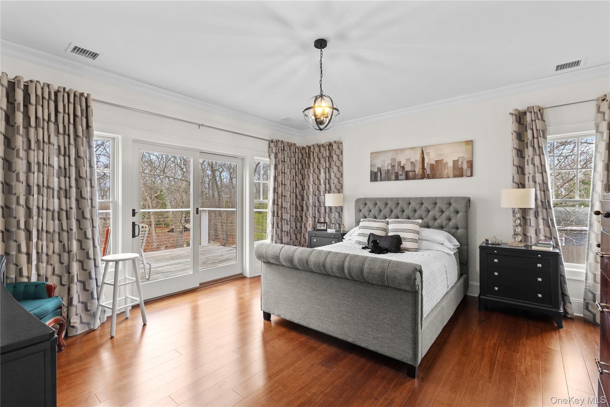 360 Masters Road Laurel, NY 11948 - Photo 34 of 49 a spacious bedroom with a bed and a large window