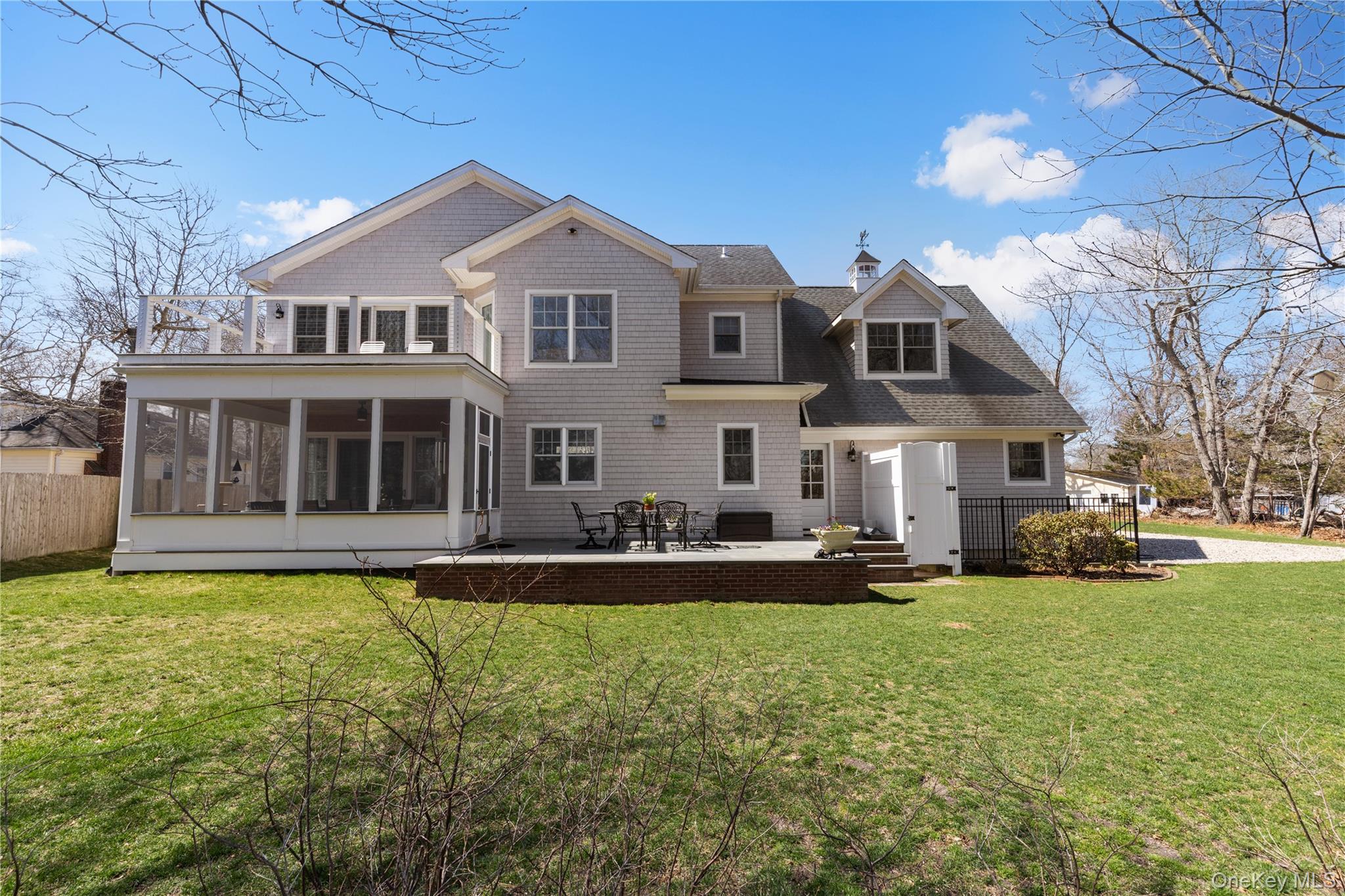 360 Masters Road Laurel, NY 11948 - Photo 43 of 49 a front view of a house with a garden and yard