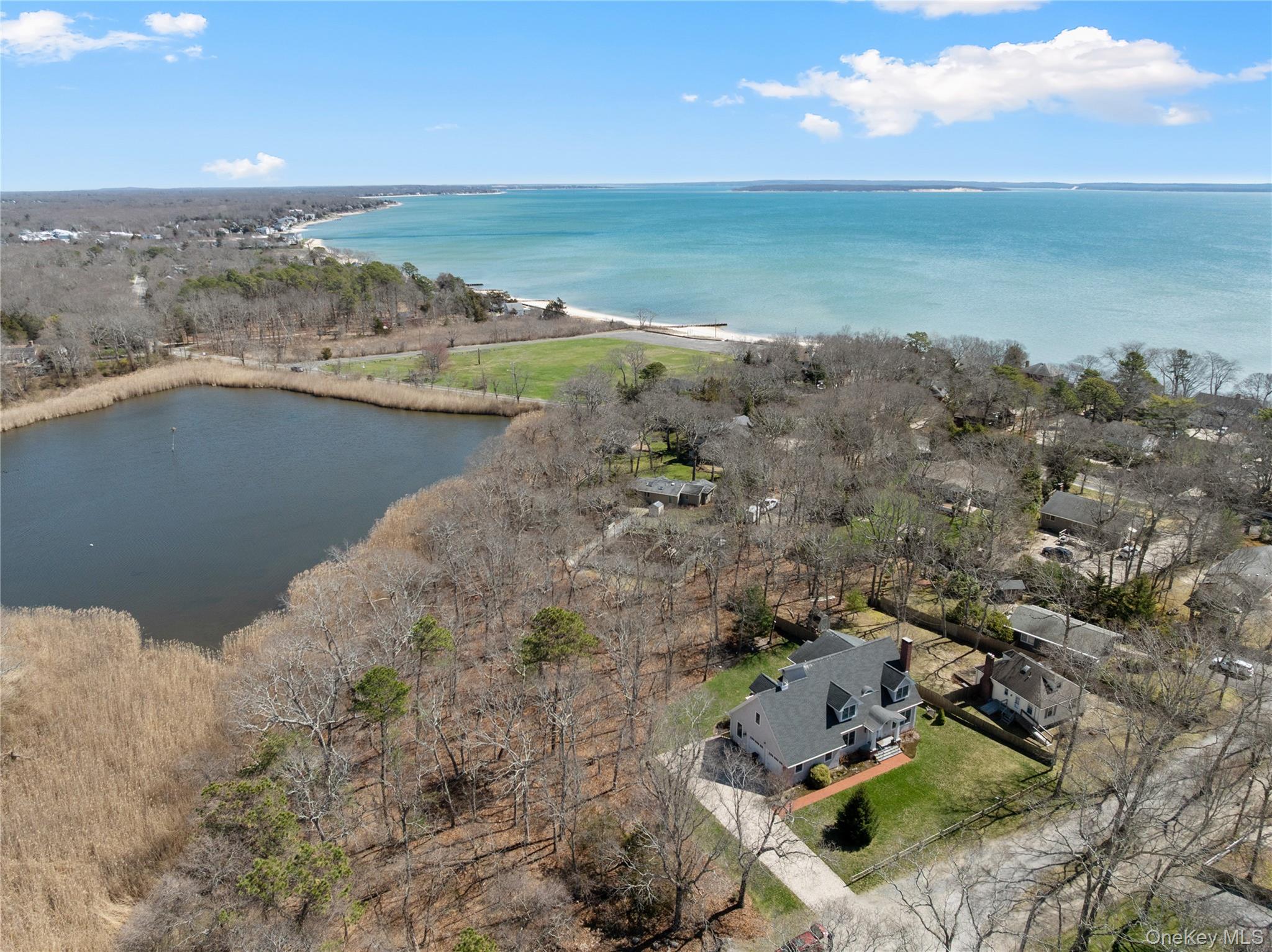 360 Masters Road Laurel, NY 11948 - Photo 5 of 49 a view of a lake with a mountain