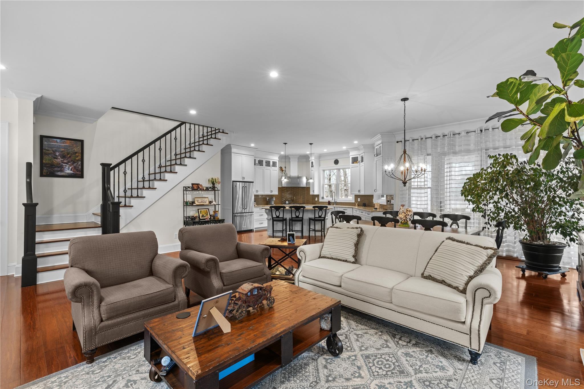 360 Masters Road Laurel, NY 11948 - Photo 10 of 49 a living room with furniture potted plant and a ceiling fan