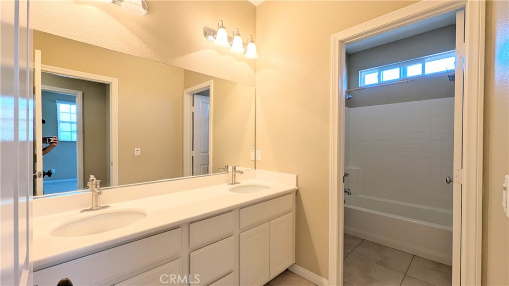 1169 Parkview Drive Oceanside, CA 92057 - Photo 20 of 27 a bathroom with a tub sink and mirror