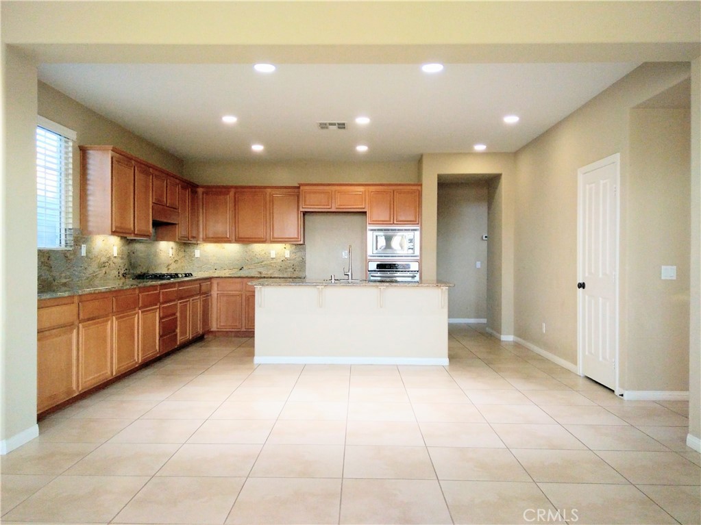 1169 Parkview Drive Oceanside, CA 92057 - Photo 5 of 27 a large kitchen with a large counter top and stainless steel appliances