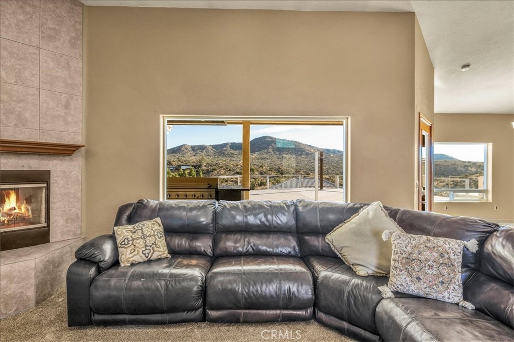 7959 Stephenson Lane Yucca Valley, CA 92284 - Photo 18 of 75 a living room with furniture and a large window