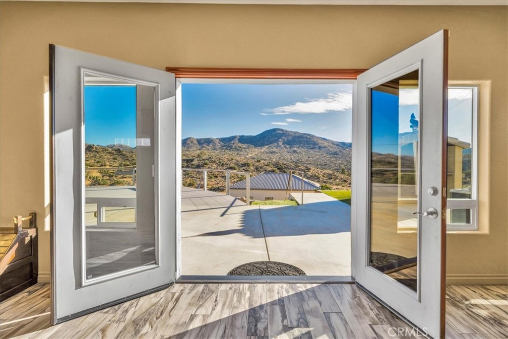 7959 Stephenson Lane Yucca Valley, CA 92284 - Photo 31 of 75 a view of a living room hardwood floor and a large window