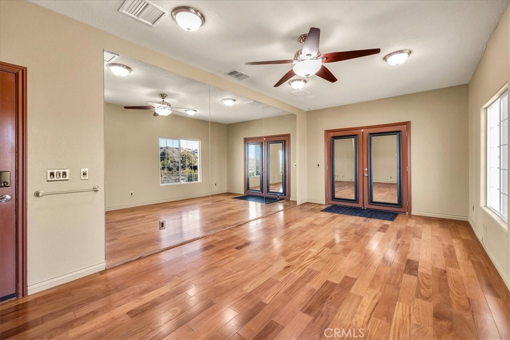 7959 Stephenson Lane Yucca Valley, CA 92284 - Photo 56 of 75 a view of livingroom with hardwood floor and ceiling fan