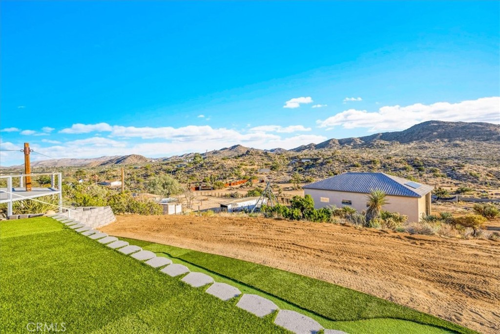 7959 Stephenson Lane Yucca Valley, CA 92284 - Photo 65 of 75 a view of a house with a yard